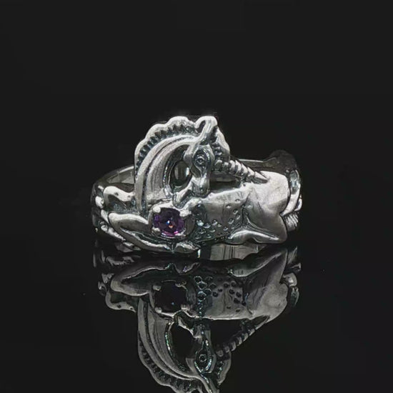 A detailed sterling silver unicorn ring with a vibrant gemstone heart, designed for lovers of unicorn jewelry and fantasy-inspired accessories by Le Dragon Argenté.