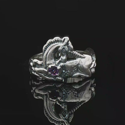 A detailed sterling silver unicorn ring with a vibrant gemstone heart, designed for lovers of unicorn jewelry and fantasy-inspired accessories by Le Dragon Argenté.