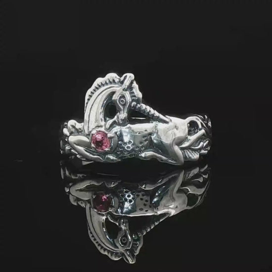 A detailed sterling silver unicorn ring with a vibrant gemstone heart, designed for lovers of unicorn jewelry and fantasy-inspired accessories by Le Dragon Argenté.