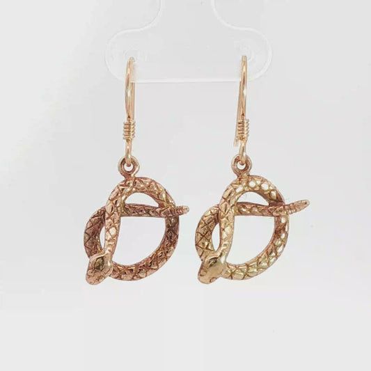 Antique bronze rattlesnake charm earrings, western gothic snake jewelry, small coiled serpent dangle earrings, desert inspired animal jewelry, edgy minimalist reptile earrings for everyday wear by Le Dragon Argenté