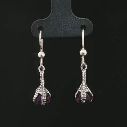 These sterling silver claw dangle earrings feature a gemstone bead and are part of the handmade fantasy jewellery collection by Le Dragon Argenté.