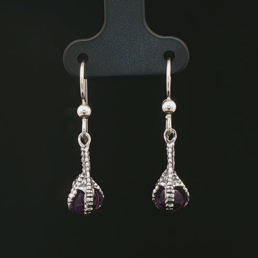 These sterling silver claw dangle earrings feature a gemstone bead and are part of the handmade fantasy jewellery collection by Le Dragon Argenté.