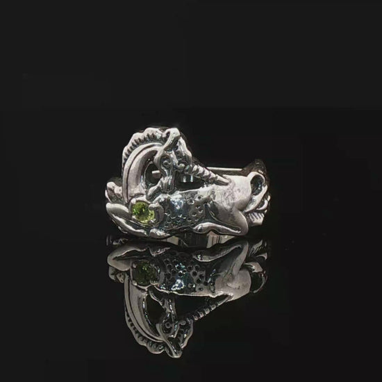 A detailed sterling silver unicorn ring with a vibrant gemstone heart, designed for lovers of unicorn jewelry and fantasy-inspired accessories by Le Dragon Argenté.