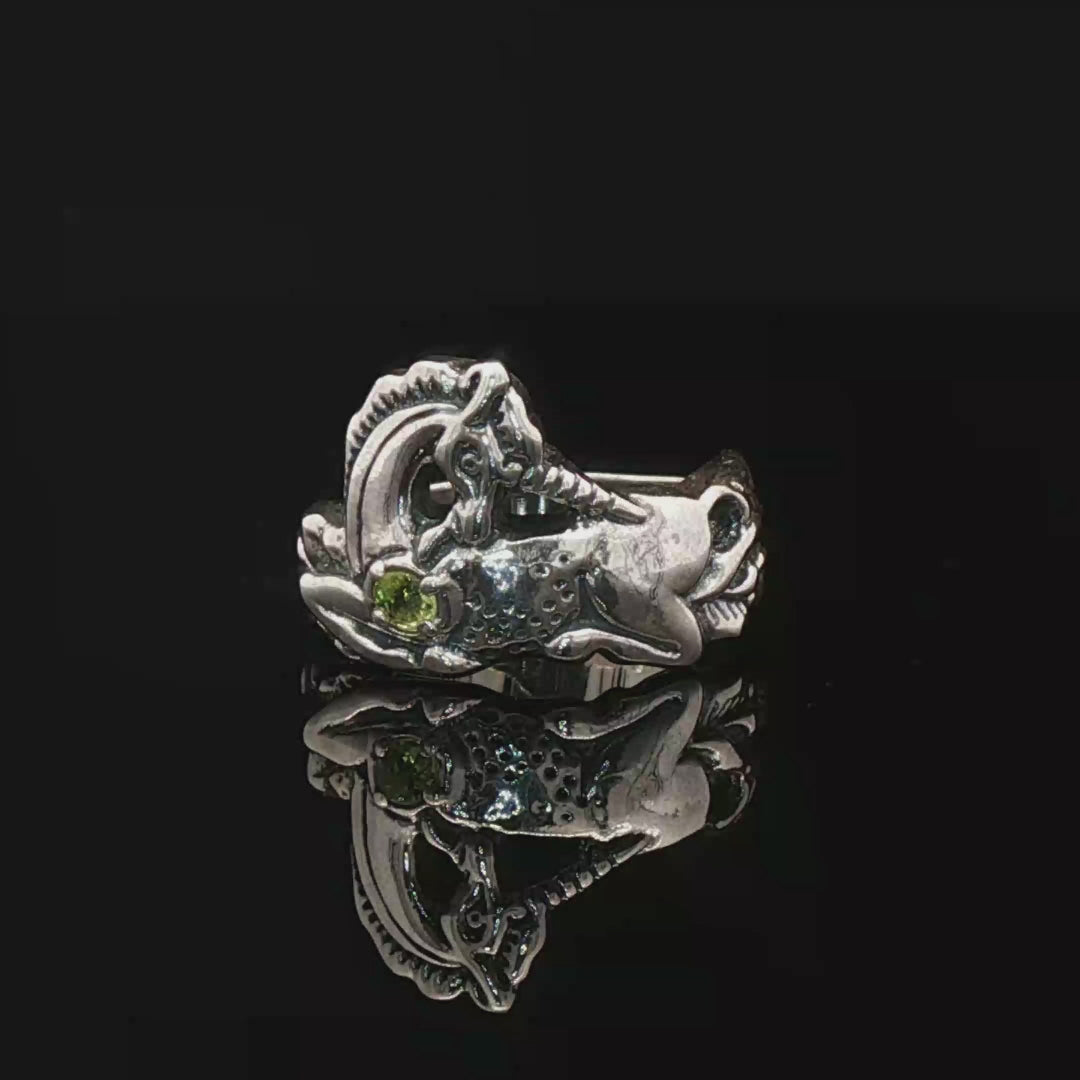 A detailed sterling silver unicorn ring with a vibrant gemstone heart, designed for lovers of unicorn jewelry and fantasy-inspired accessories by Le Dragon Argenté.