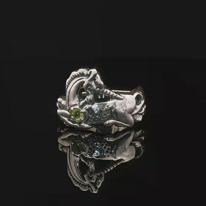 A detailed sterling silver unicorn ring with a vibrant gemstone heart, designed for lovers of unicorn jewelry and fantasy-inspired accessories by Le Dragon Argenté.