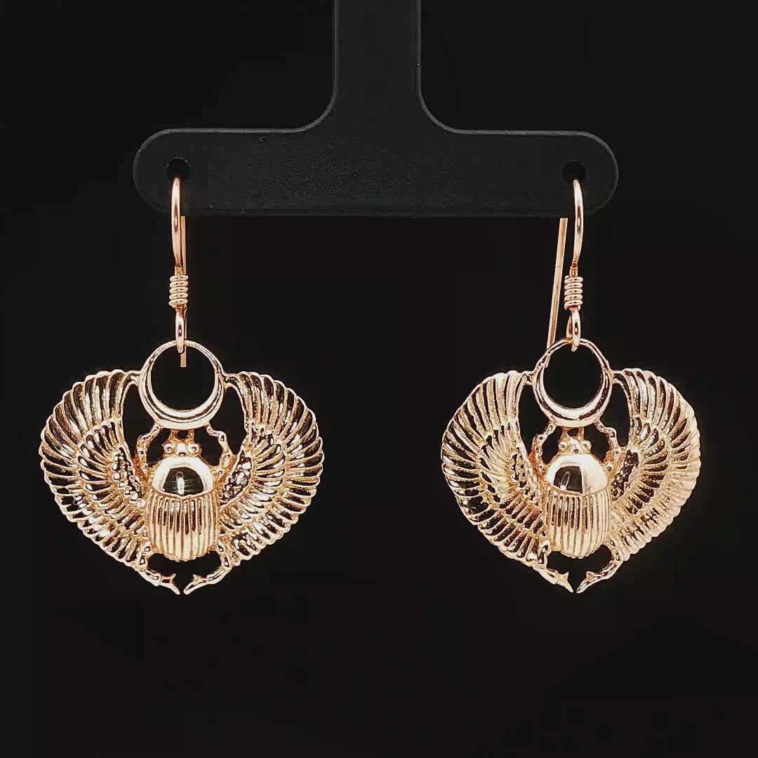 Handmade Winged scarab beetle earrings inspired by ancient Egyptian jewellery, available in sterling silver, antique bronze, or stainless steel. These symbolic scarab talisman earrings represent protection, rebirth, and transformation. A meaningful accessory for mythology lovers, museum enthusiasts, and those who enjoy unique handcrafted historical-style jewellery.