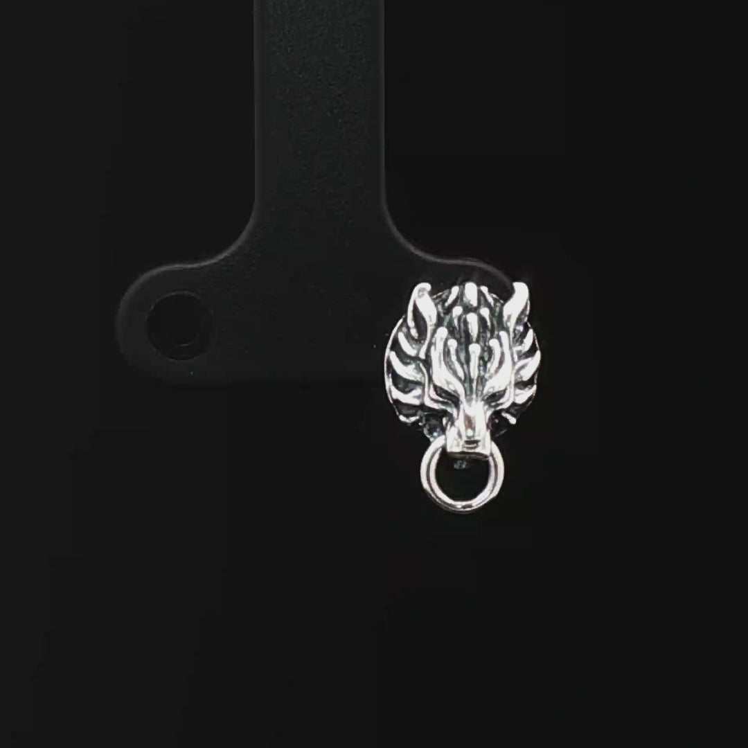 Handcrafted FF7 Fenrir stud earrings in sterling silver, inspired by Final Fantasy VII, featuring intricate wolf design for retro gamer fans and jewellery lovers alike.