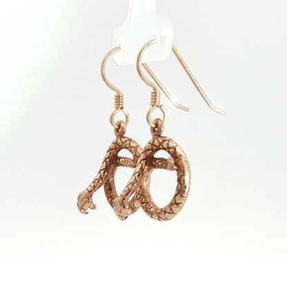 Antique bronze rattlesnake charm earrings, western gothic snake jewelry, small coiled serpent dangle earrings, desert inspired animal jewelry, edgy minimalist reptile earrings for everyday wear by Le Dragon Argenté