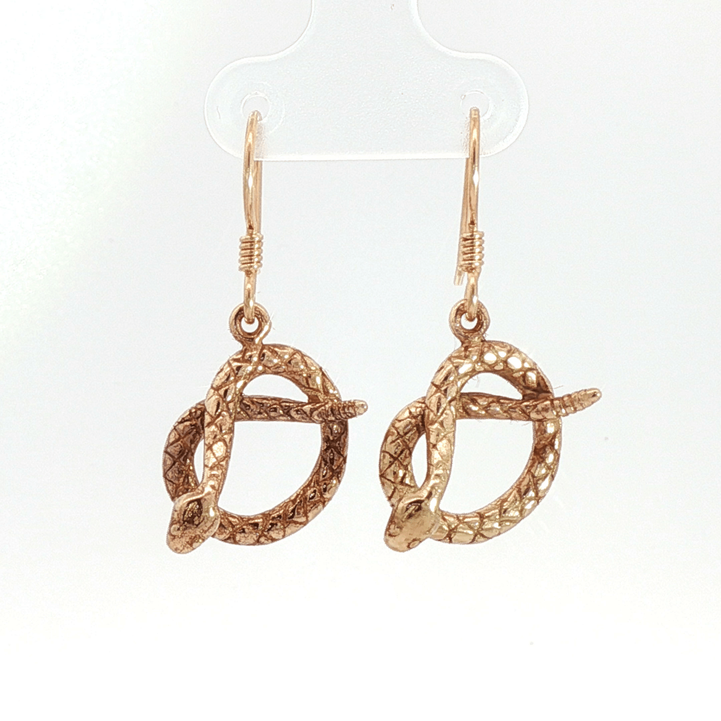 Antique bronze rattlesnake charm earrings, western gothic snake jewelry, small coiled serpent dangle earrings, desert inspired animal jewelry, edgy minimalist reptile earrings for everyday wear by Le Dragon Argenté