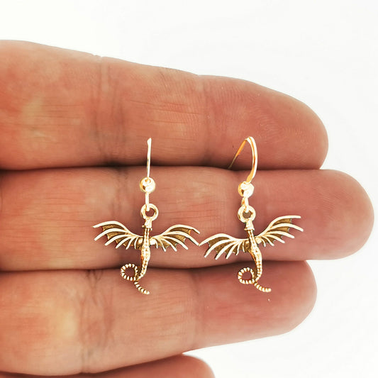 flying dragon charm earrings in gold made to order, flying dragon gold earrings, gold dragon earrings, gold dragon jewelry, gold dragon jewellery, flying dragon earrings, small dragon earrings, small gold dragon earrings, golden dragon earrings, small dragon dangle earrings, gold dangle earrings