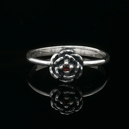Handmade Small Rose Ring in .925 Sterling Silver featuring a delicate sculpted rose with a 1.5mm genuine gemstone at its centre. Elegant and dainty yet durable, this floral ring makes a perfect gift of love, promise, or self-expression. Crafted by Le Dragon Argenté in Montreal, Canada.
