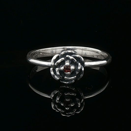 Handmade Small Rose Ring in .925 Sterling Silver featuring a delicate sculpted rose with a 1.5mm genuine gemstone at its centre. Elegant and dainty yet durable, this floral ring makes a perfect gift of love, promise, or self-expression. Crafted by Le Dragon Argenté in Montreal, Canada.