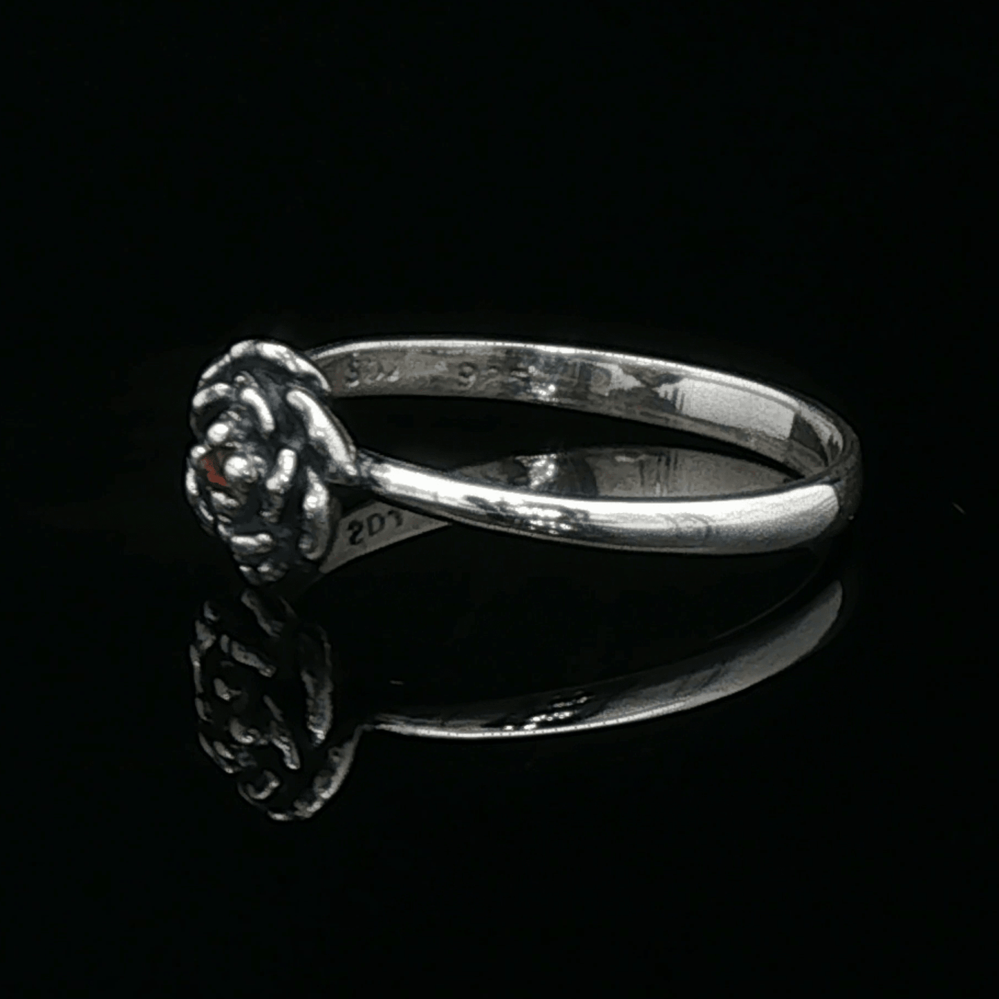 Handmade Small Rose Ring in .925 Sterling Silver featuring a delicate sculpted rose with a 1.5mm genuine gemstone at its centre. Elegant and dainty yet durable, this floral ring makes a perfect gift of love, promise, or self-expression. Crafted by Le Dragon Argenté in Montreal, Canada.
