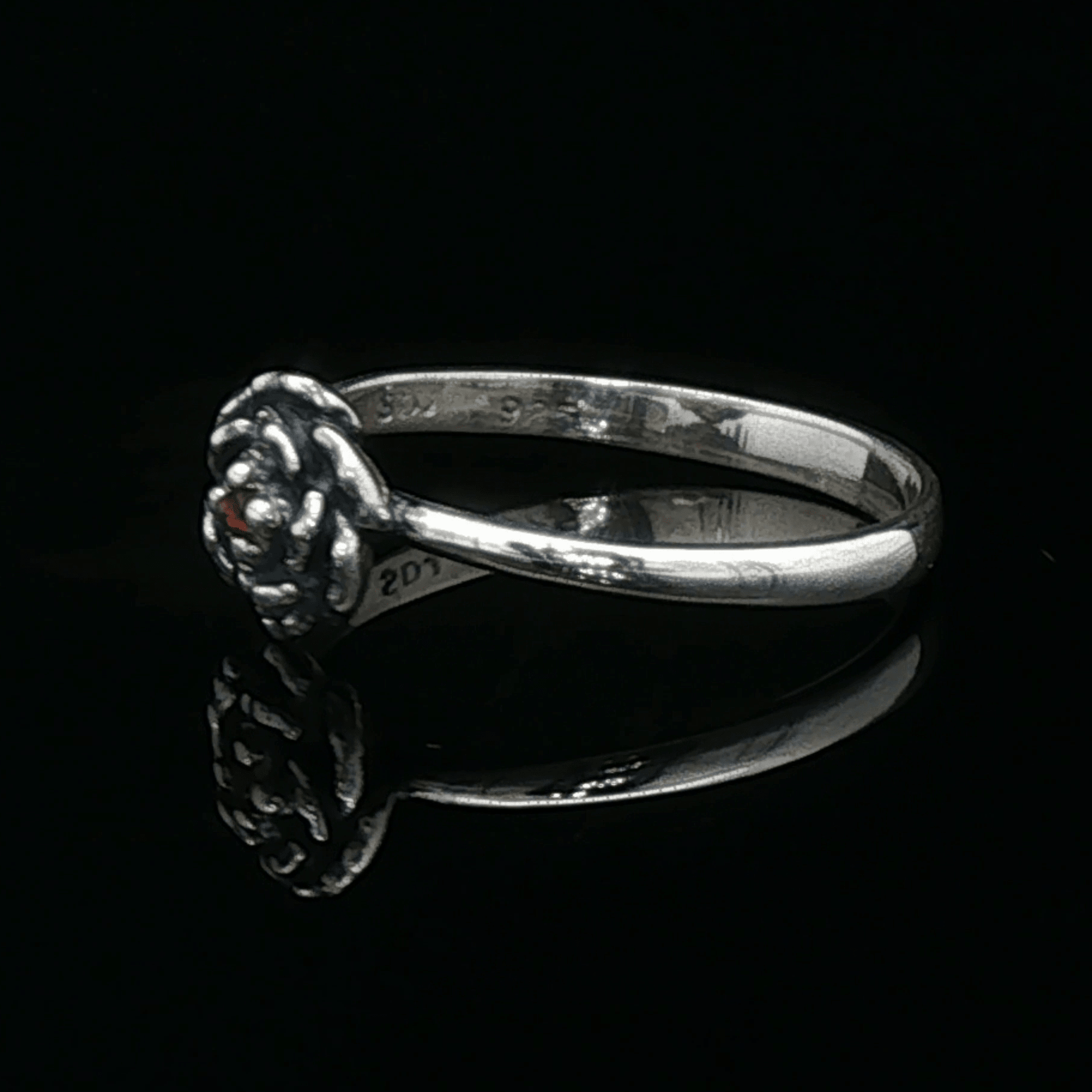 Handmade Small Rose Ring in .925 Sterling Silver featuring a delicate sculpted rose with a 1.5mm genuine gemstone at its centre. Elegant and dainty yet durable, this floral ring makes a perfect gift of love, promise, or self-expression. Crafted by Le Dragon Argenté in Montreal, Canada.