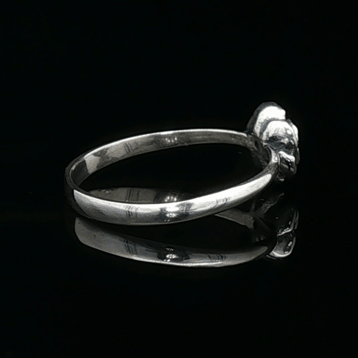 Handmade Small Rose Ring in .925 Sterling Silver featuring a delicate sculpted rose with a 1.5mm genuine gemstone at its centre. Elegant and dainty yet durable, this floral ring makes a perfect gift of love, promise, or self-expression. Crafted by Le Dragon Argenté in Montreal, Canada.