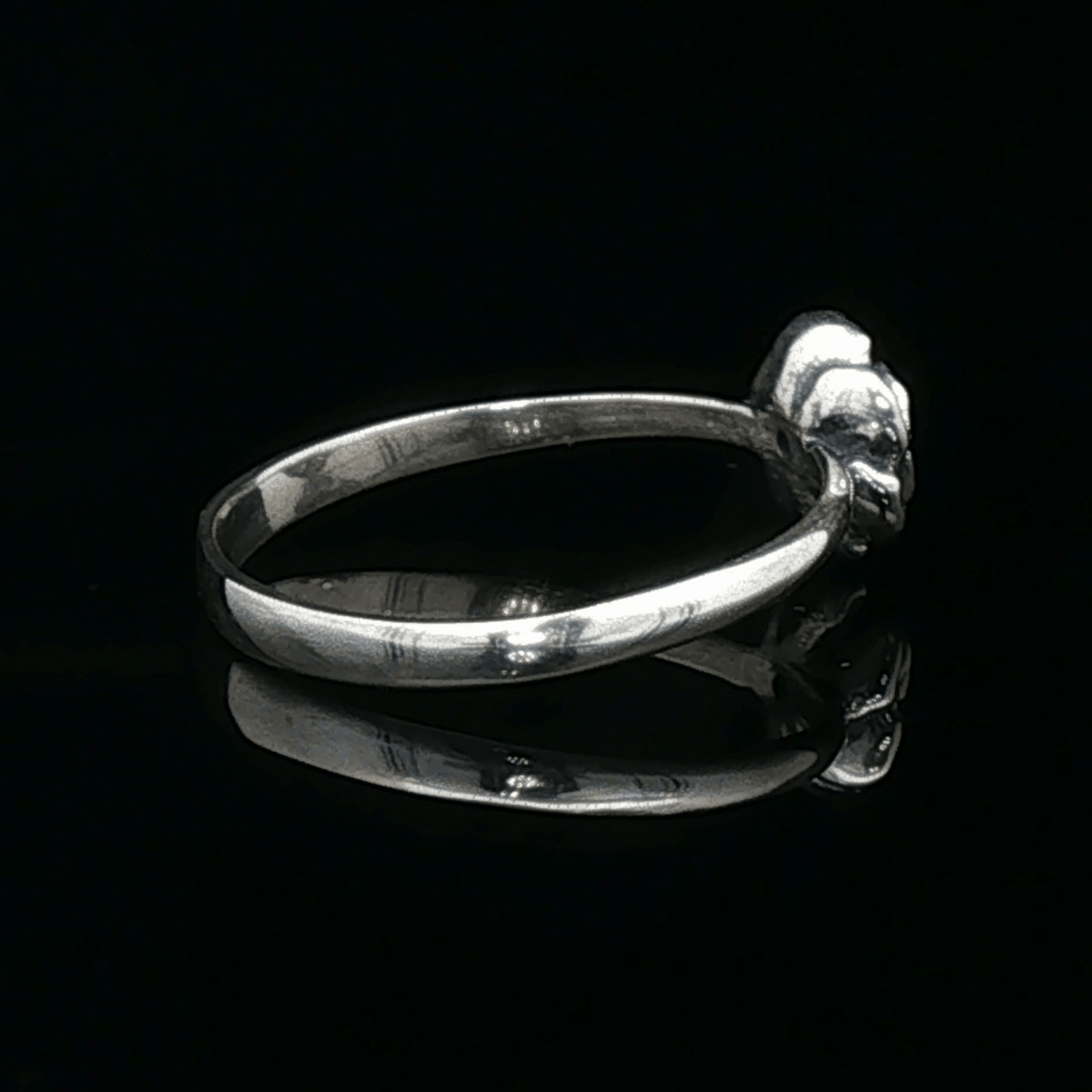 Handmade Small Rose Ring in .925 Sterling Silver featuring a delicate sculpted rose with a 1.5mm genuine gemstone at its centre. Elegant and dainty yet durable, this floral ring makes a perfect gift of love, promise, or self-expression. Crafted by Le Dragon Argenté in Montreal, Canada.