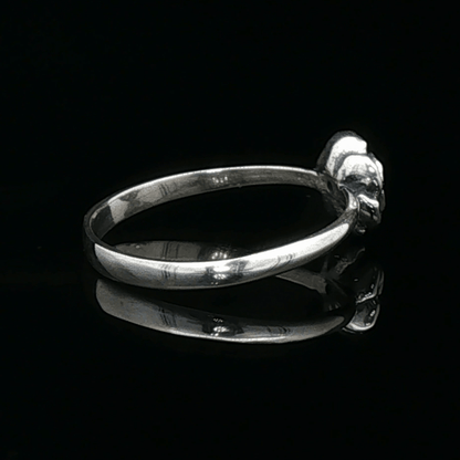 Handmade Small Rose Ring in .925 Sterling Silver featuring a delicate sculpted rose with a 1.5mm genuine gemstone at its centre. Elegant and dainty yet durable, this floral ring makes a perfect gift of love, promise, or self-expression. Crafted by Le Dragon Argenté in Montreal, Canada.