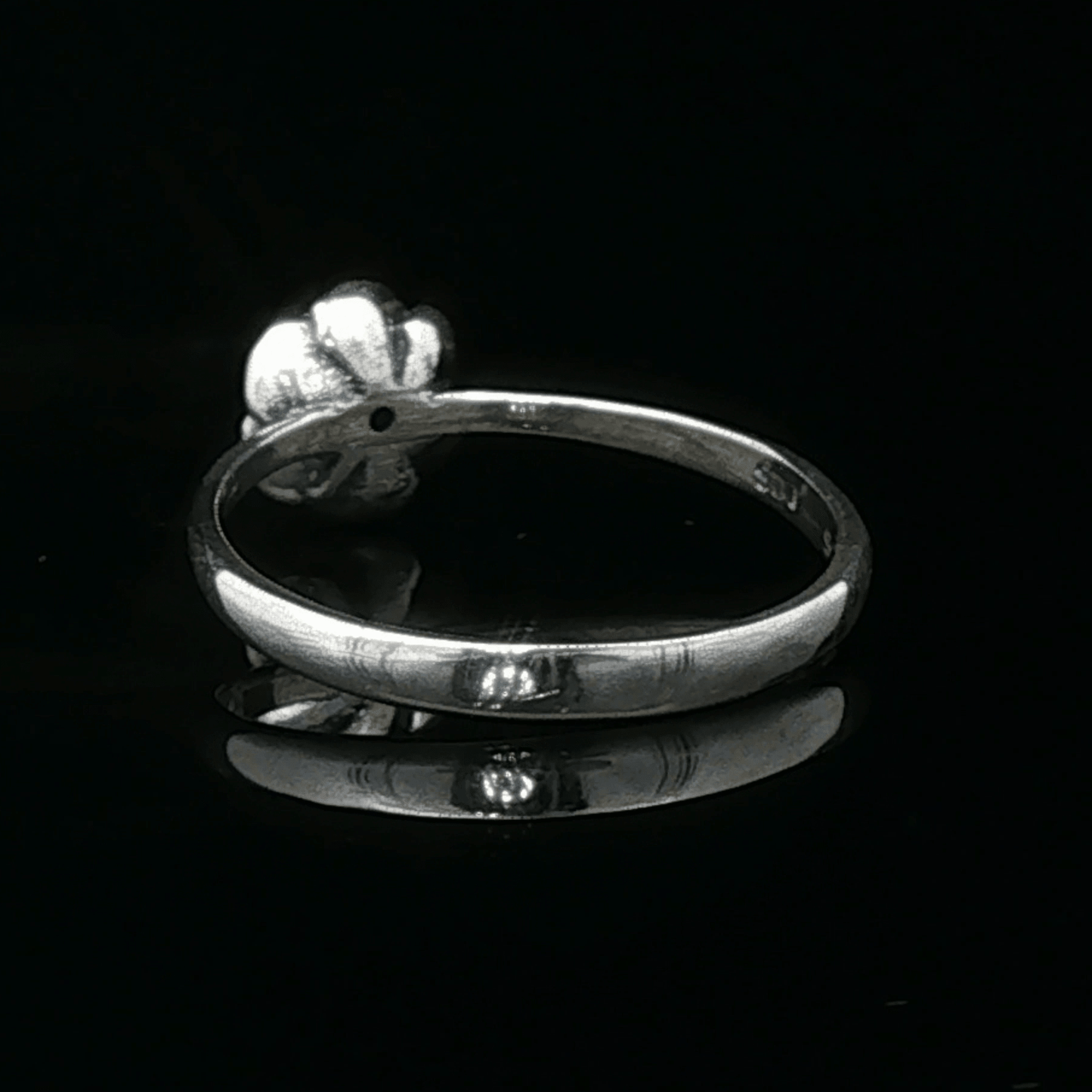 Handmade Small Rose Ring in .925 Sterling Silver featuring a delicate sculpted rose with a 1.5mm genuine gemstone at its centre. Elegant and dainty yet durable, this floral ring makes a perfect gift of love, promise, or self-expression. Crafted by Le Dragon Argenté in Montreal, Canada.