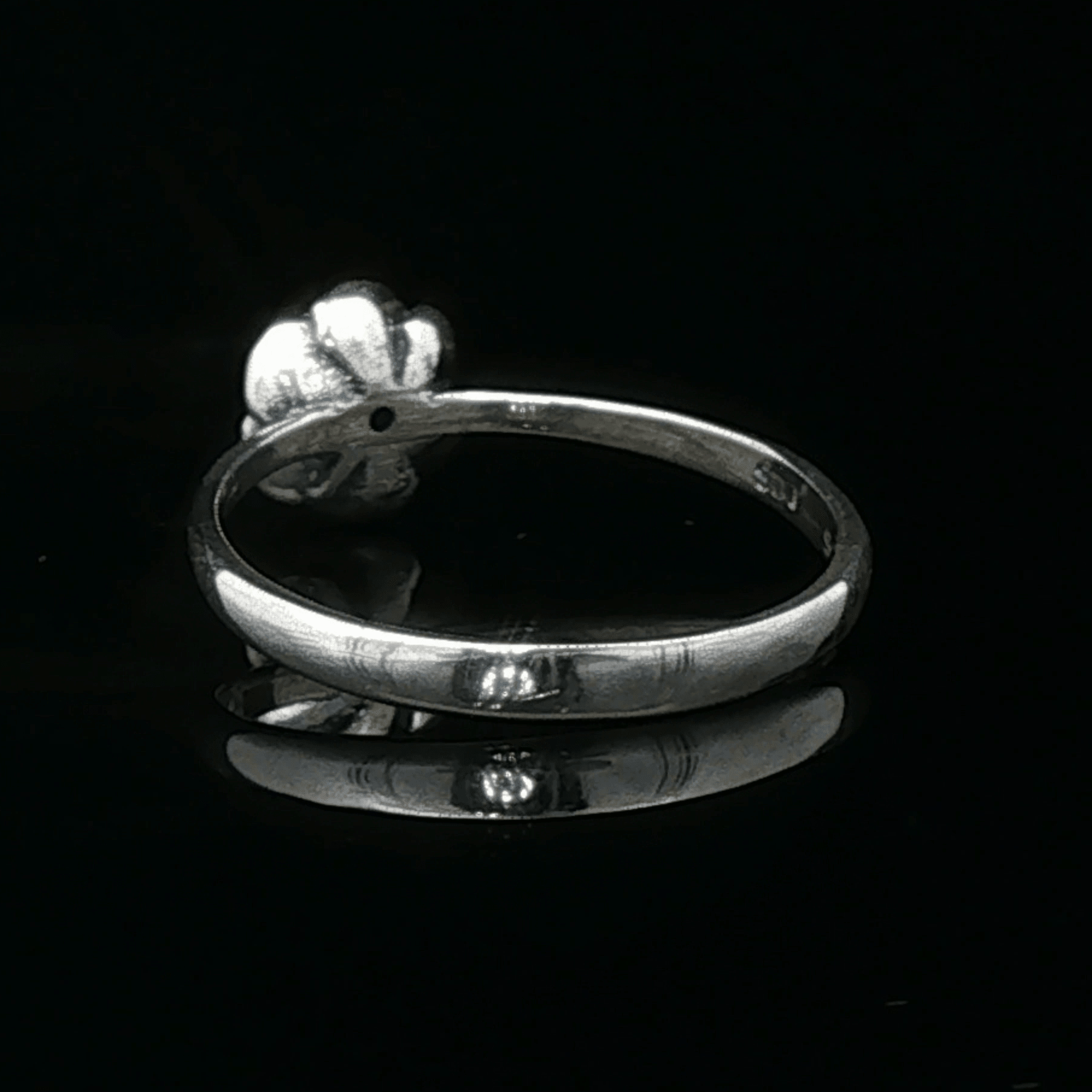 Handmade Small Rose Ring in .925 Sterling Silver featuring a delicate sculpted rose with a 1.5mm genuine gemstone at its centre. Elegant and dainty yet durable, this floral ring makes a perfect gift of love, promise, or self-expression. Crafted by Le Dragon Argenté in Montreal, Canada.