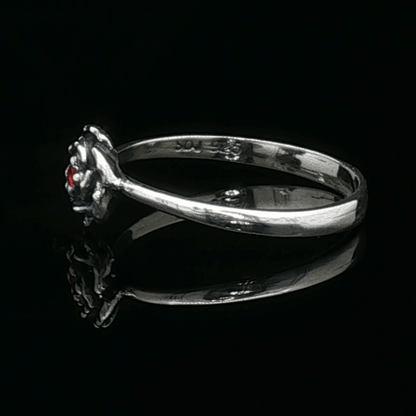 Handmade Small Rose Ring in .925 Sterling Silver featuring a delicate sculpted rose with a 1.5mm coloured cubic zirconia birthstone at its centre. Elegant and dainty yet durable, this floral ring makes a perfect gift of love, promise, or self-expression. Crafted by Le Dragon Argenté in Montreal, Canada.