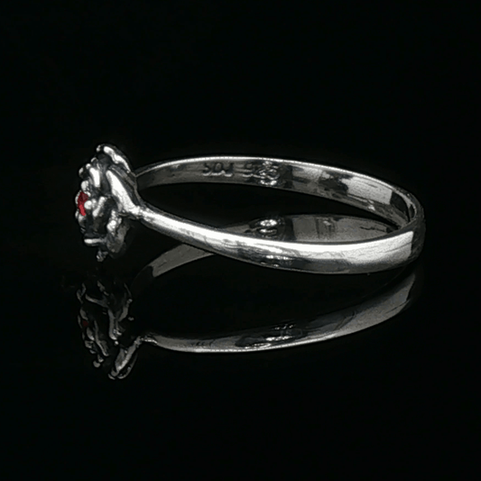 Handmade Small Rose Ring in .925 Sterling Silver featuring a delicate sculpted rose with a 1.5mm coloured cubic zirconia birthstone at its centre. Elegant and dainty yet durable, this floral ring makes a perfect gift of love, promise, or self-expression. Crafted by Le Dragon Argenté in Montreal, Canada.