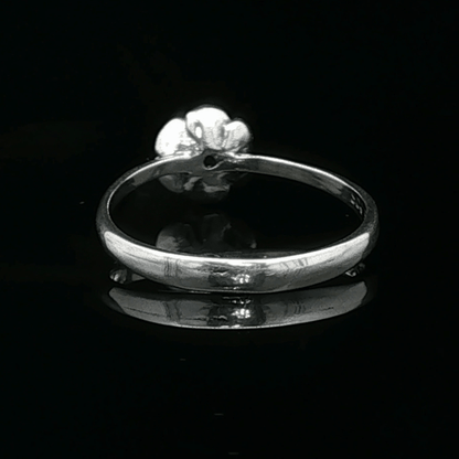 Handmade Small Rose Ring in .925 Sterling Silver featuring a delicate sculpted rose with a 1.5mm coloured cubic zirconia birthstone at its centre. Elegant and dainty yet durable, this floral ring makes a perfect gift of love, promise, or self-expression. Crafted by Le Dragon Argenté in Montreal, Canada.
