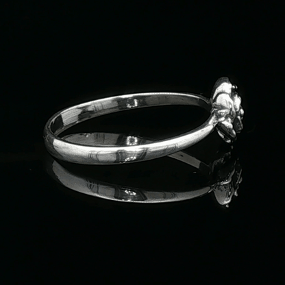 Handmade Small Rose Ring in .925 Sterling Silver featuring a delicate sculpted rose with a 1.5mm coloured cubic zirconia birthstone at its centre. Elegant and dainty yet durable, this floral ring makes a perfect gift of love, promise, or self-expression. Crafted by Le Dragon Argenté in Montreal, Canada.