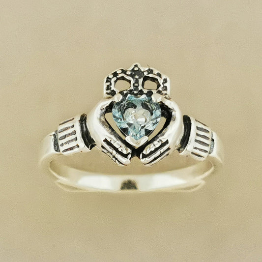 Sterling silver Claddagh ring with a heart-shaped imitation birthstone. Features the classic Irish Celtic hands, heart, and crown design, symbolizing love, loyalty, and friendship. Perfect for women, gifts, or everyday Celtic-inspired jewelry.