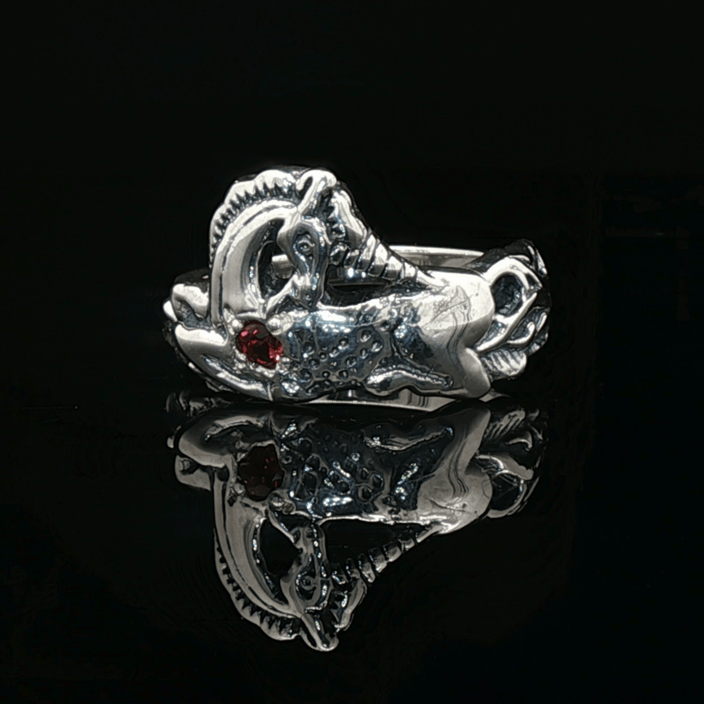 A detailed sterling silver unicorn ring with a vibrant gemstone heart, designed for lovers of unicorn jewelry and fantasy-inspired accessories by Le Dragon Argenté.