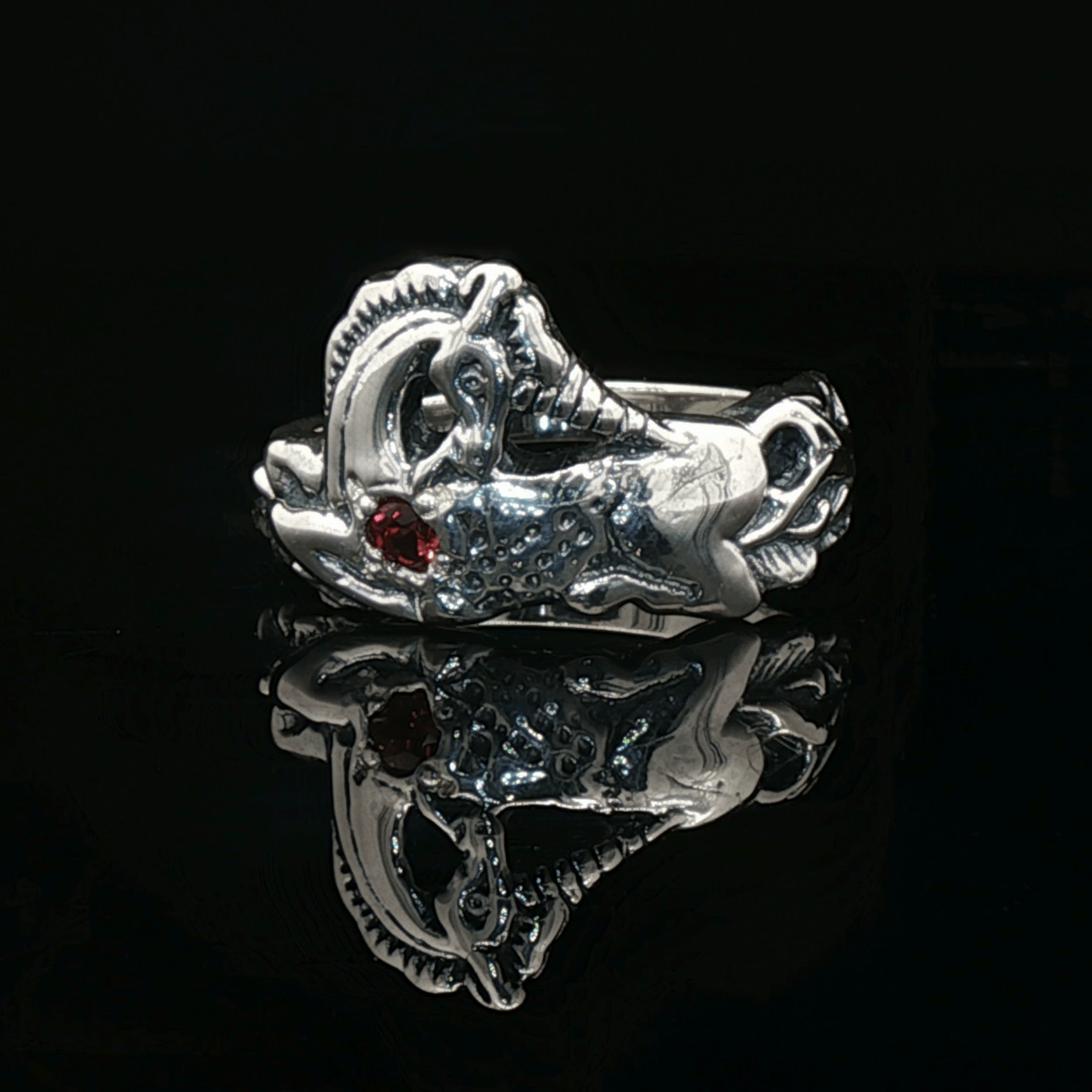 A detailed sterling silver unicorn ring with a vibrant gemstone heart, designed for lovers of unicorn jewelry and fantasy-inspired accessories by Le Dragon Argenté.