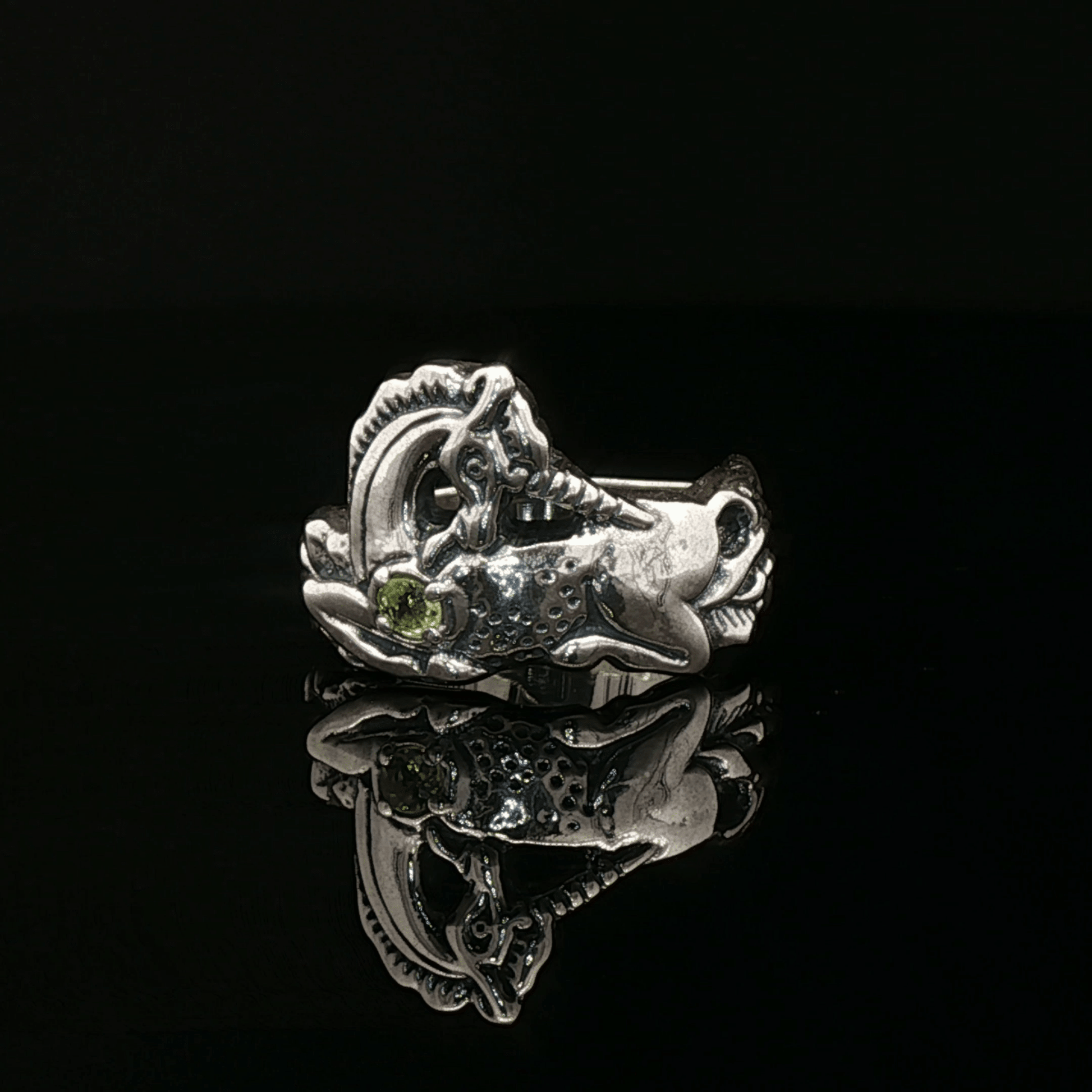 A detailed sterling silver unicorn ring with a vibrant gemstone heart, designed for lovers of unicorn jewelry and fantasy-inspired accessories by Le Dragon Argenté.