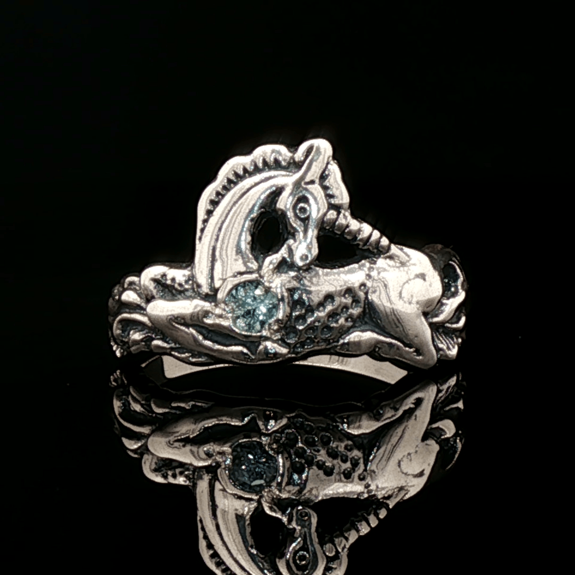 A detailed sterling silver unicorn ring accented with a colorful imitation birthstone heart, ideal for fans of unicorn jewelry and fantasy-inspired accessories by Le Dragon Argenté.