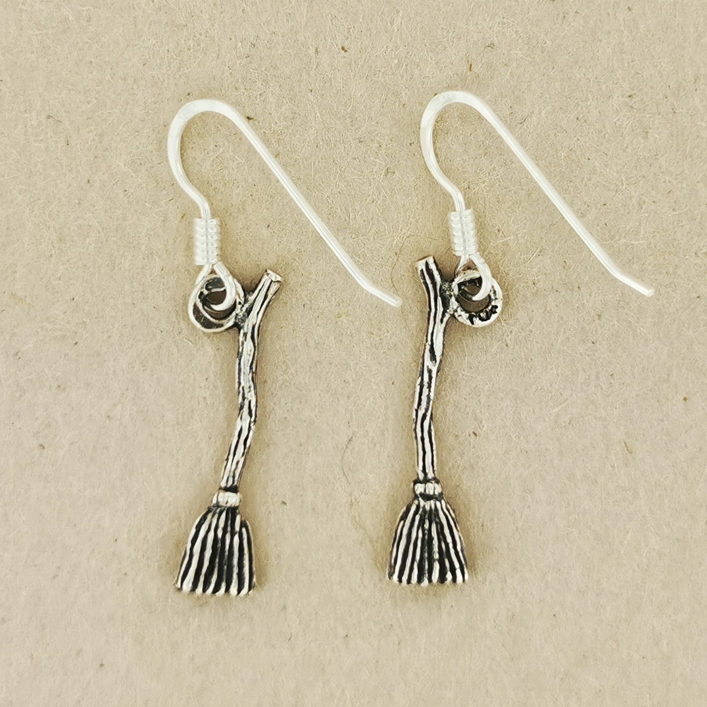 witches broom charm earrings, witchy earrings, witches broom earrings, silver broom earrings, silver witch earrings, silver pagan earrings, silver witchy earrings, broom charms, broom earrings in sterling silver, esoteric earrings, silver brooms, small witch earrings, witch's broom earrings