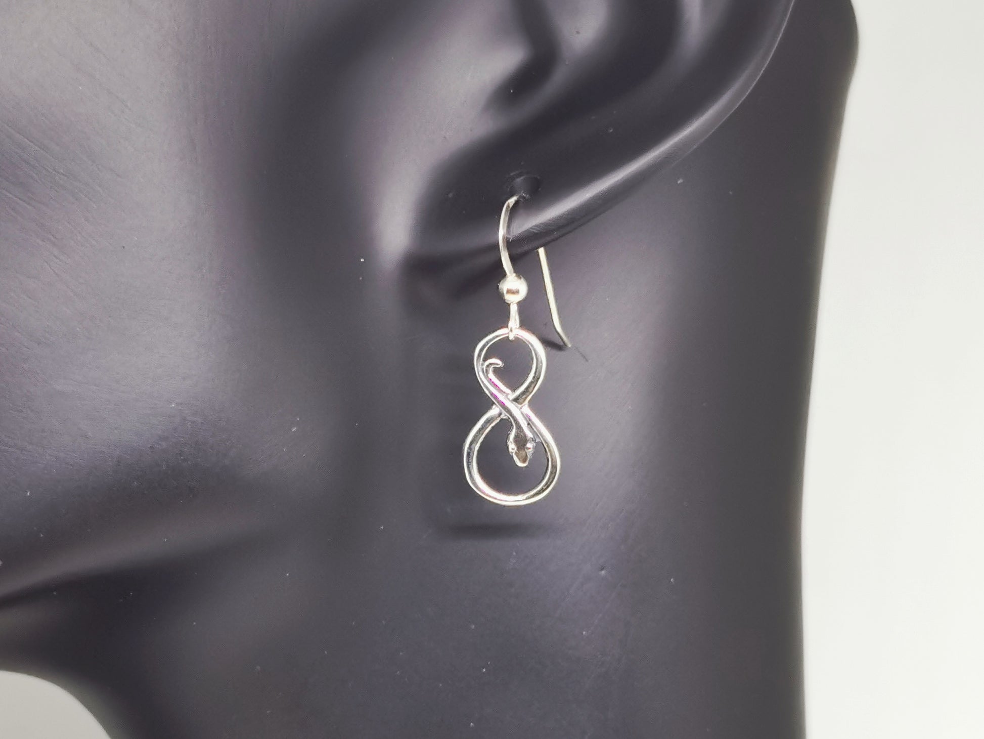 dangle coiled snake charm earring in sterling silver