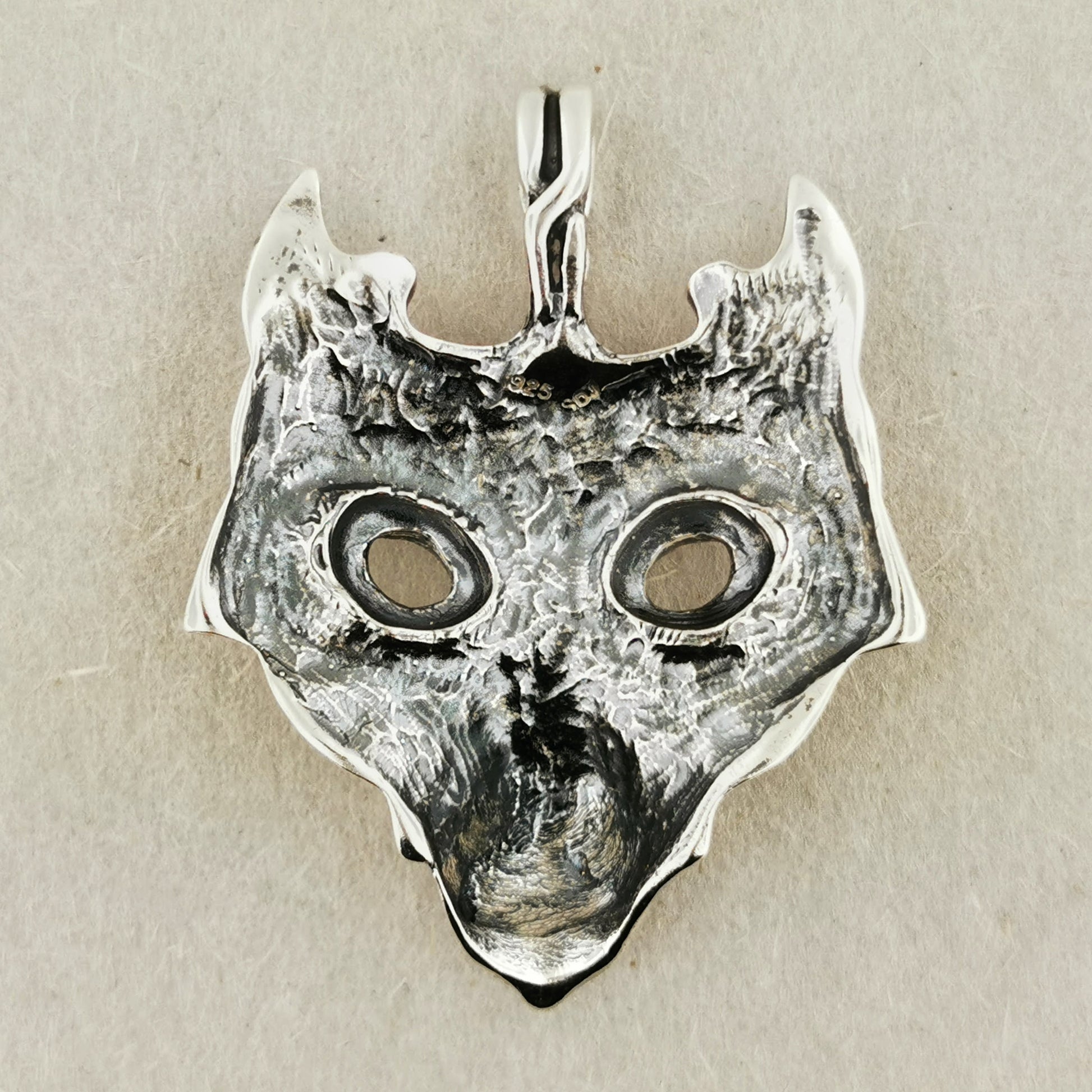 tribal wolf pendant in sterling silver back