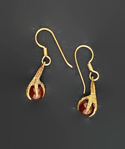 Claw dangle earrings with gemstone bead